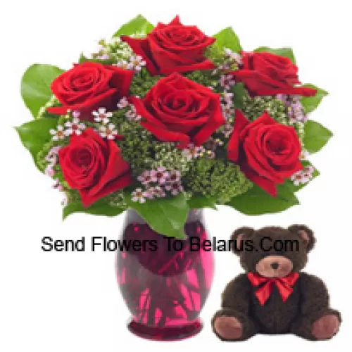 7 Red Roses With Some Ferns In A Glass Vase Along With A Cute 14 Inches Tall Teddy Bear