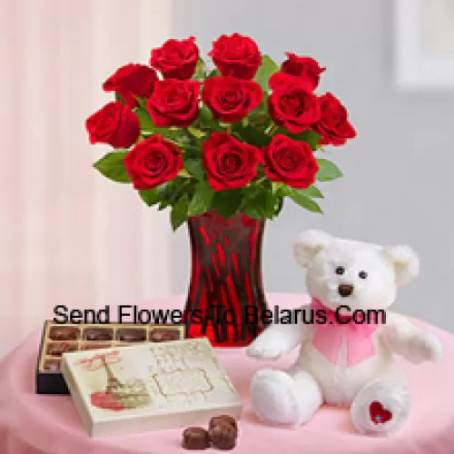 11 Red Roses With Some Ferns In A Glass Vase, A Cute 12 Inches Tall White Teddy Bear And An Imported Box Of Chocolates