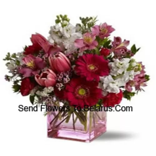 Red Roses, Red Tulips And Assorted Flowers With Seasonal Fillers Arranged Beautifully In A Glass Vase