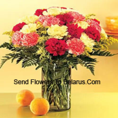 25 Mixed Colored Carnations With Seasonal Fillers In A Glass Vase