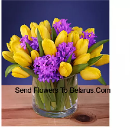 Yellow Tulips Arranged Beautifully In A Glass Vase - Please Note That In Case Of Non-Availability Of Certain Seasonal Flowers The Same Will Be Substituted With Other Flowers Of Same Value