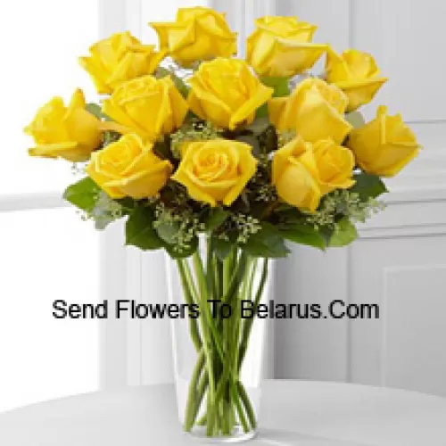 11 Yellow Roses With Some Ferns In A Glass Vase