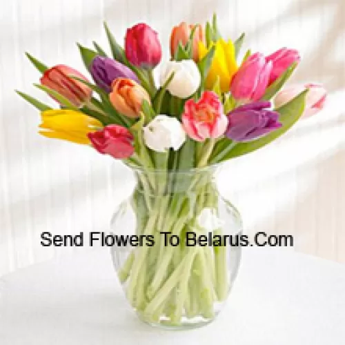 Mixed Colored Tulips In A Glass Vase - Please Note That In Case Of Non-Availability Of Certain Seasonal Flowers The Same Will Be Substituted With Other Flowers Of Same Value