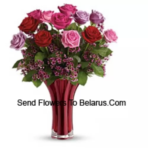 11 Mixed Colored Roses With Some Ferns in A Vase