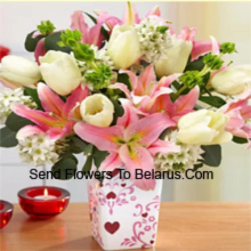 Pink Lilies And White Tulips With Assorted White Fillers In A Glass Vase - Please Note That In Case Of Non-Availability Of Certain Seasonal Flowers The Same Will Be Substituted With Other Flowers Of Same Value