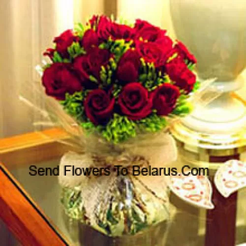 11 Red Roses With Some Ferns In A Vase