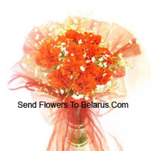 11 Orange Carnations With Some Ferns In A Vase