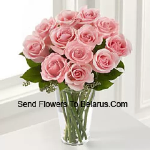 11 Pink Roses With Some Ferns In A Vase