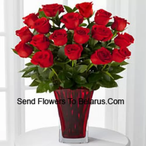 19 Red Roses With Seasonal Fillers In A Glass Vase Decorated With A Pink Bow