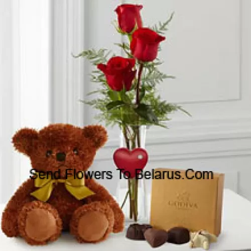 Three Red Roses With Some Ferns In A Vase, A Cute Brown 10 Inches Teddy Bear And A Box Of Godiva Chocolates. (We reserve the right to substitute the Godiva chocolates with chocolates of equal value in case of non-availability of the same. Limited Stock)