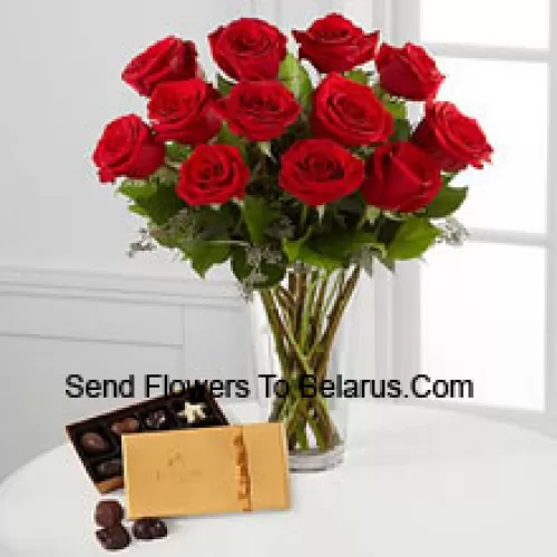 11 Red Roses With Some Ferns In A Vase And A Box Of Godiva Chocolates (We reserve the right to substitute the Godiva chocolates with chocolates of equal value in case of non-availability of the same. Limited Stock)