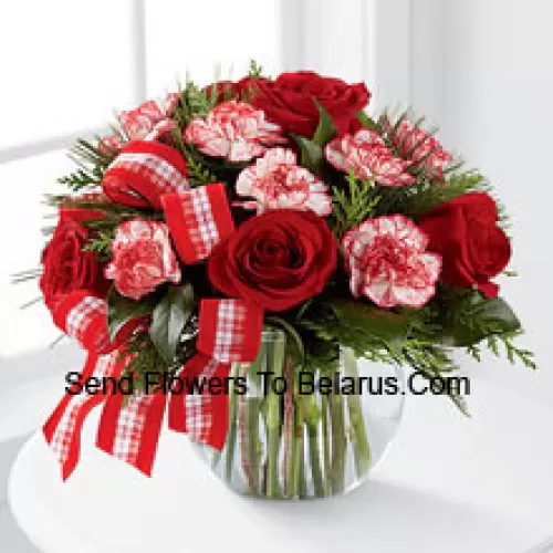 Send warm wishes and bright sentiments for a wonderful holiday season! Rich red roses and peppermint carnations are delicately arranged with holiday greens to create a festive display. Arriving in a clear glass bubble bowl and accented with a red and white plaid ribbon, this arrangement is full of seasonal sophistication. (Please Note That We Reserve The Right To Substitute Any Product With A Suitable Product Of Equal Value In Case Of Non-Availability Of A Certain Product)